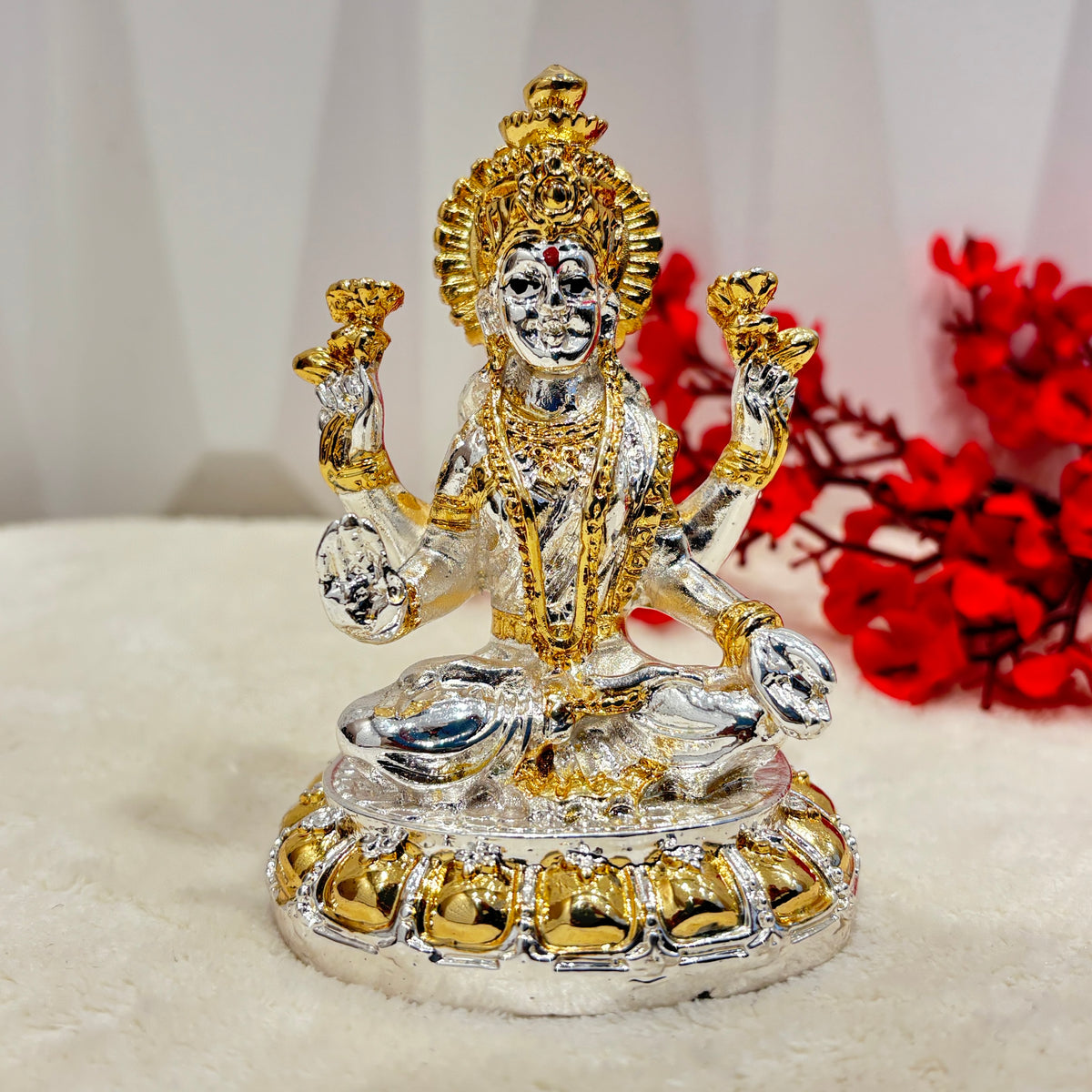 Add some divine charm to your home with this 8 inch Antique Silver Lakshmi Idol. Coated with gold and silver, this authentic 24 carat gold.